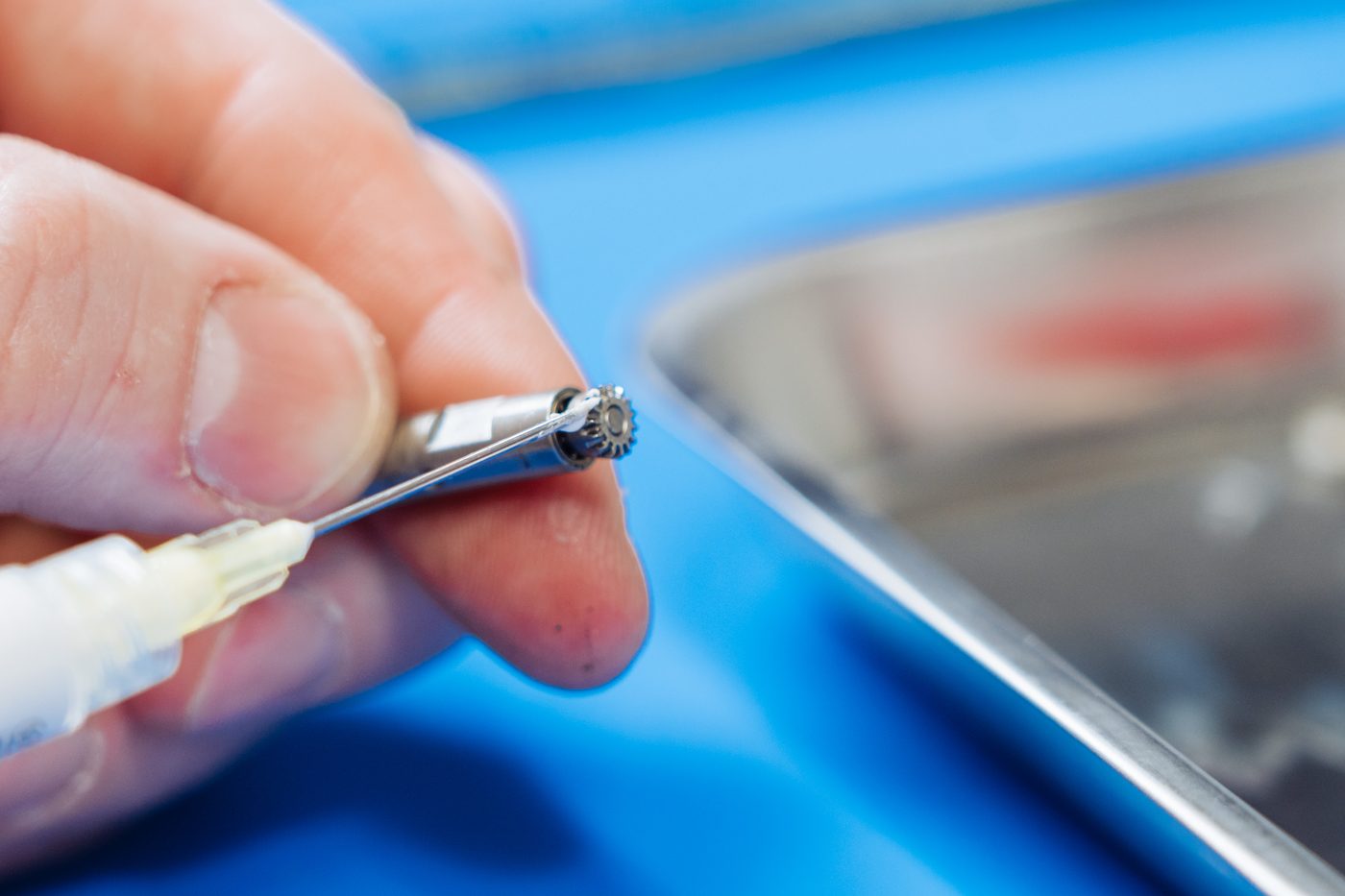 Technician testing a repaired handpiece